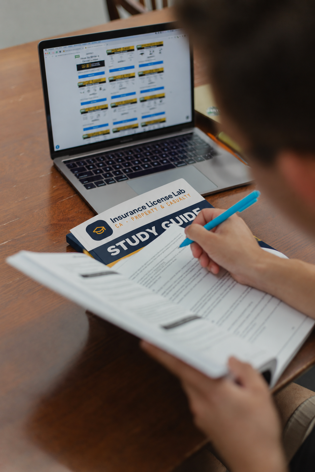 Student studying with the Insurance License Lab CA Property & Casualty study guide